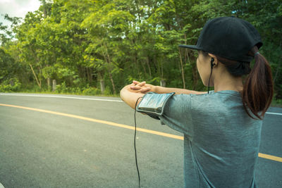 Woman standing on road