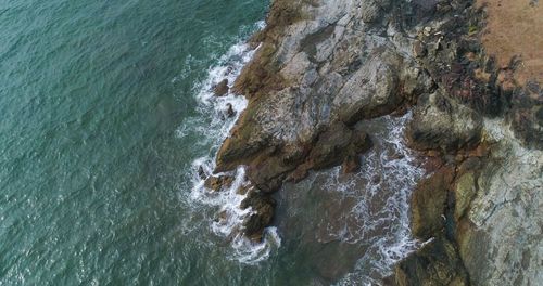 High angle view of rock formation in sea