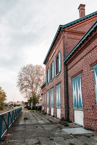 Street amidst buildings against sky