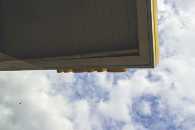 Low angle view of building against cloudy sky