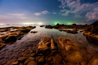 Scenic view of sea against sky at dusk