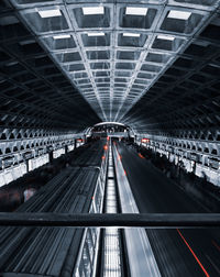 Low angle view of illuminated tunnel at subway station