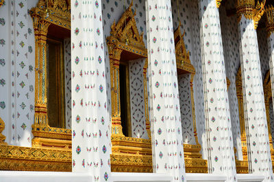 Low angle view of text amidst buildings in temple