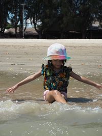 Full length of girl enjoying in water