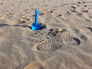 High angle view of footprints on sand