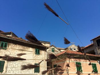 Low angle view of residential buildings against blue sky