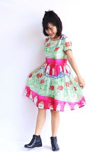 Portrait of a smiling girl standing against white background