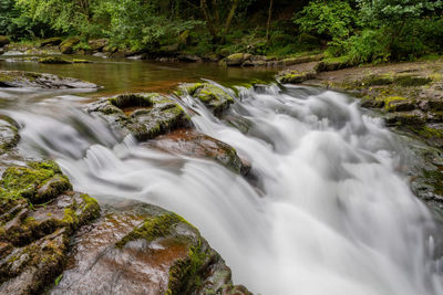 Long exposure of the waterfall at watersmeet bridge pool at watersmeet in devon