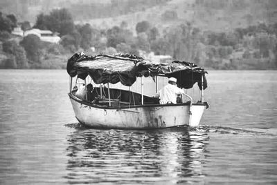 Abandoned boat in water