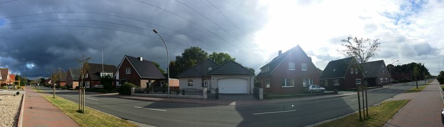 Panoramic view of houses against sky