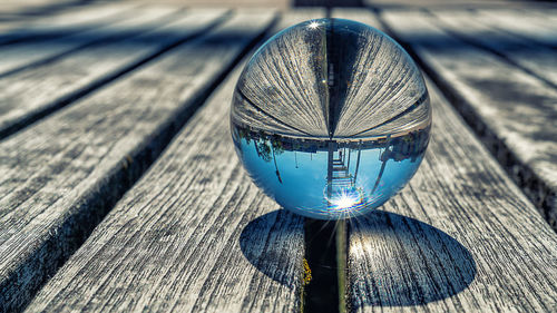 High angle view of glass on wooden table