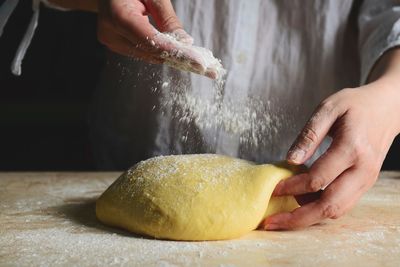 Midsection of person preparing food