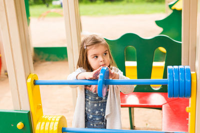 Cute girl playing in playground