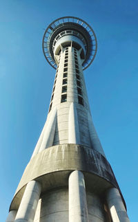 Low angle view of sky tower against blue sky