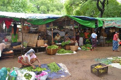 People at market stall