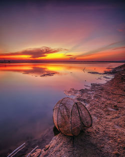 Scenic view of sea against sky at sunset