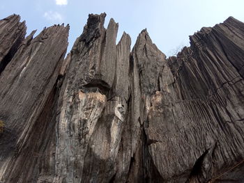 Low angle view of rock formation against sky