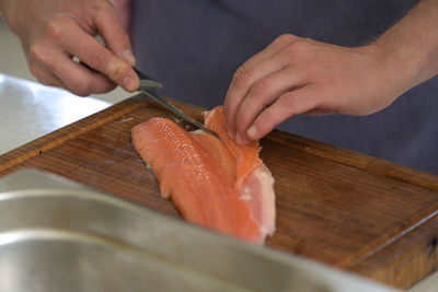 Cropped hands of man preparing food