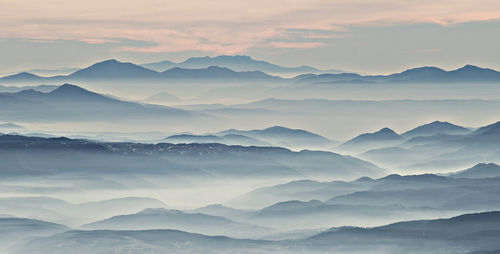 Scenic view of mountains against sky during sunset