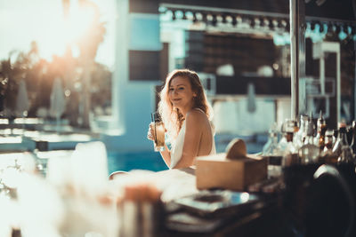 Woman sitting and looking at camera