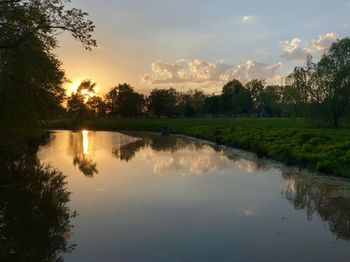 Scenic view of lake against sky during sunset