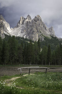 Mountain view over lake with wooden bridge. dolomites, d'antorno lake, mount misurina, italy