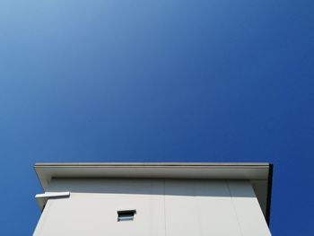 Low angle view of building against blue sky