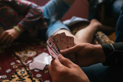 Friends playing cards at home