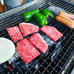 High angle view of meat on barbecue grill