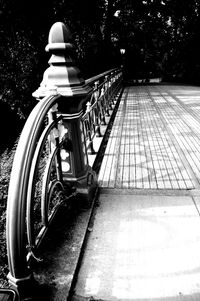 Low angle view of railing against trees