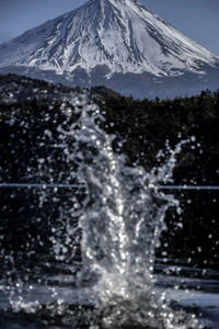 Scenic view of snowcapped mountain against sky