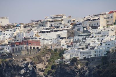 High angle view of buildings in town against sky