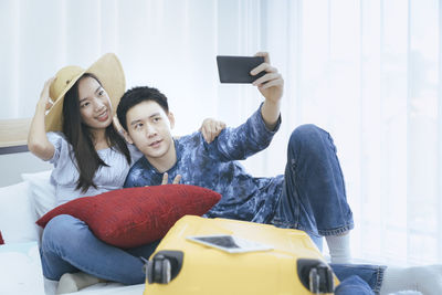 Mother and son using smart phone