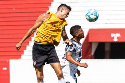 Low angle view of man playing with ball