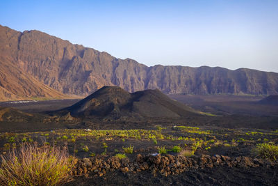 Scenic view of landscape and mountains against sky