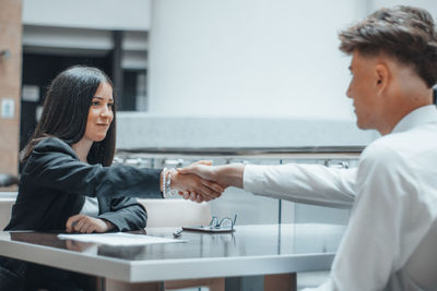 Business people shaking hand at office