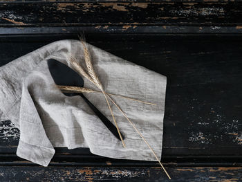 High angle view of paper hanging on wood