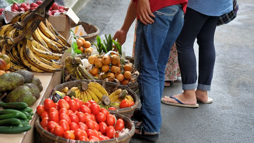 Low section of people standing in market