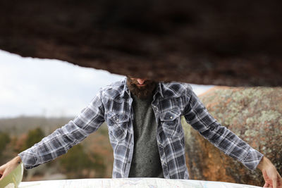 Close-up of man against sky