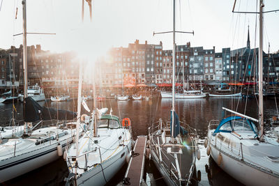 Boats moored at harbor