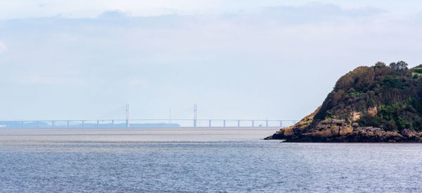 Scenic view of bay against sky