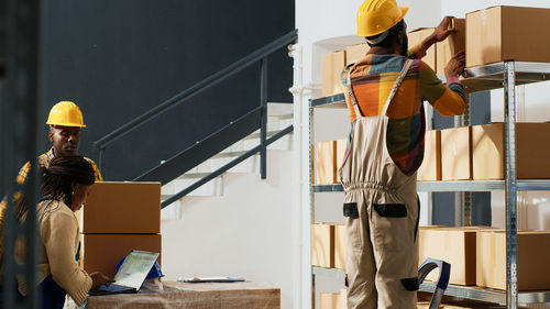 Rear view of man working at construction site