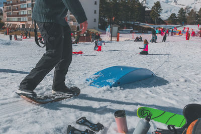 Low section of people skiing on snow