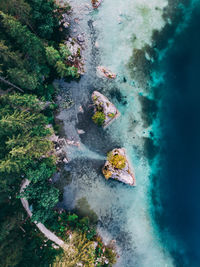 High angle view of rocks on sea shore