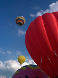Low angle view of hot air balloon against blue sky