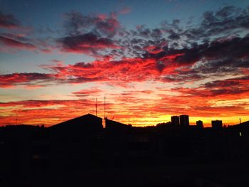 Silhouette of built structure at sunset