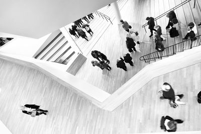 High angle view of people walking on floor