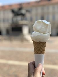 Hand holding ice cream cone