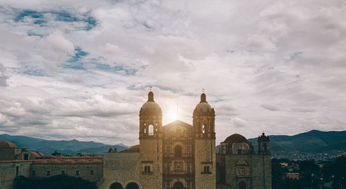 Historic building against cloudy sky