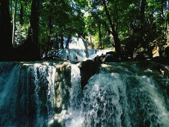 Scenic view of waterfall in sea